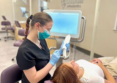orthodontist setting up dental tool next to patient callan orthodontics