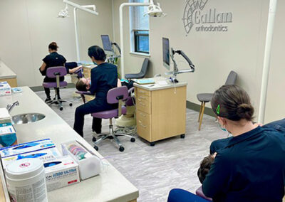 A row of orthodontists seeing to patients