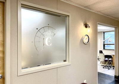 office window with frosted glass and callan orthodontics logo modern orthodontist office in lawrenceville new jersey