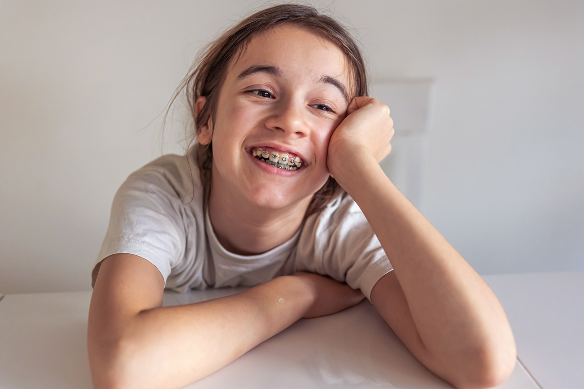 little girl smiling with braces how long does it take to get used to braces callan orthodontics