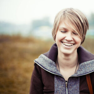 callan-teen-treatment teen smiling outdoors callan orthodontics lawrenceville, nj