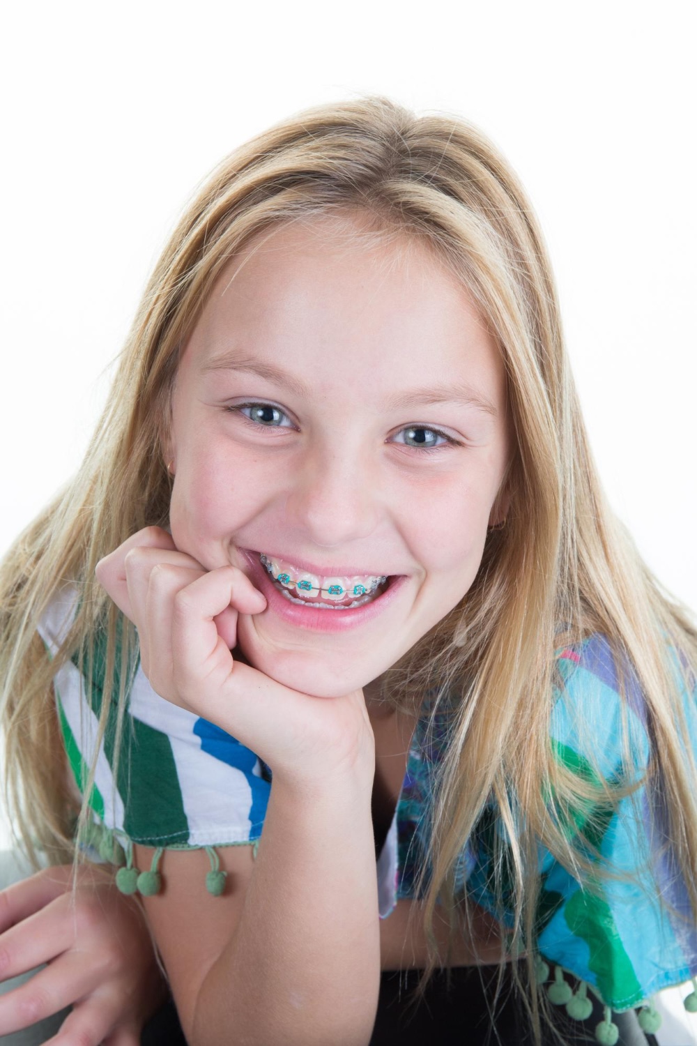 little girl in braces happy