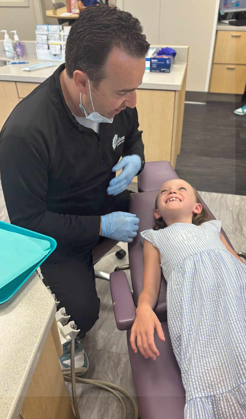 dr callan talking to young girl pediatric orthodontist in lawrenceville nj callan orthodontics